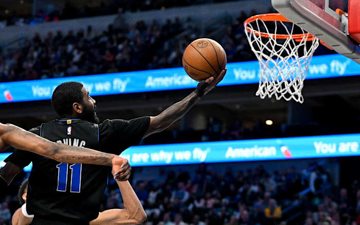 Kyrie Irving goes for a layup.